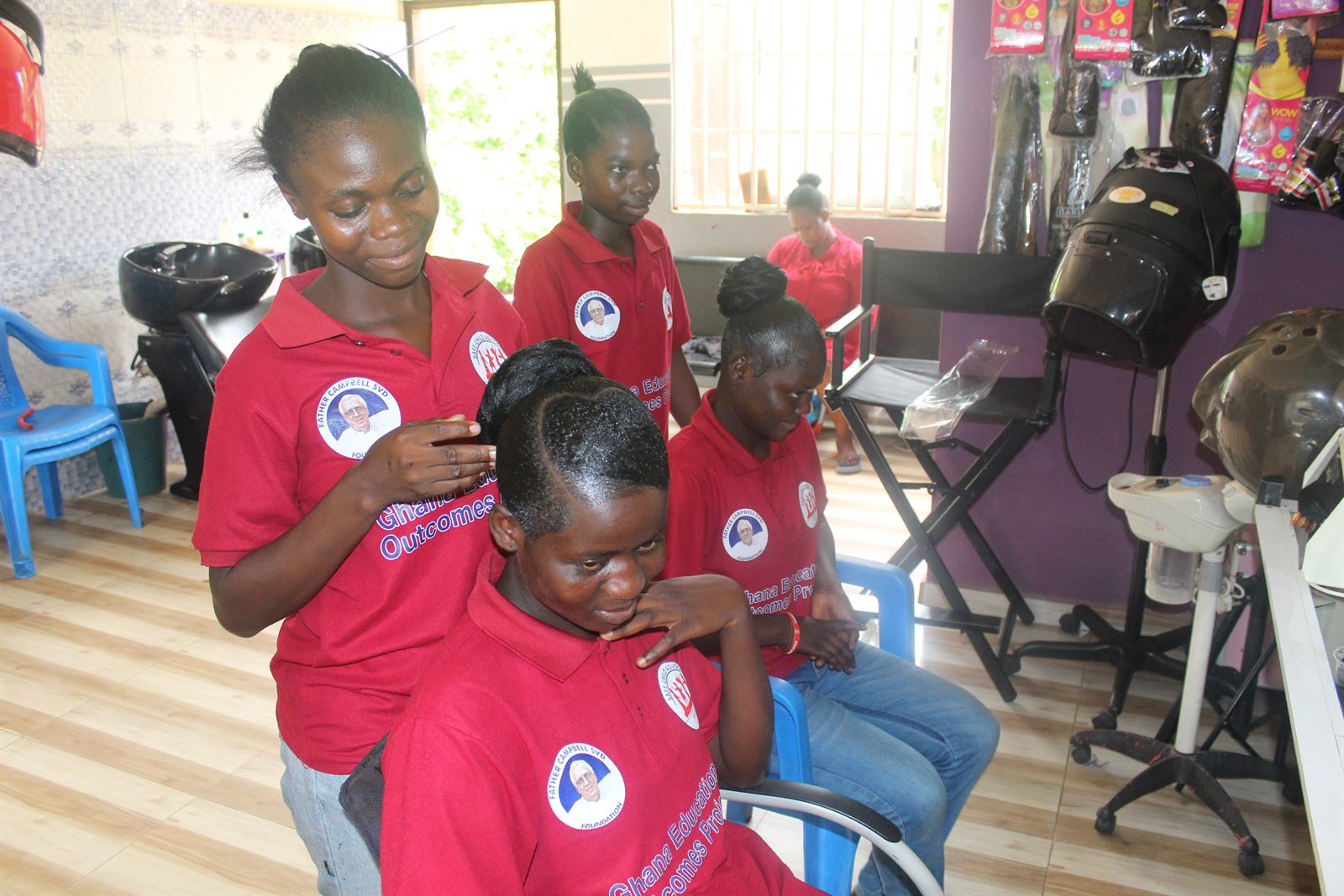 Learners practising hairdressing